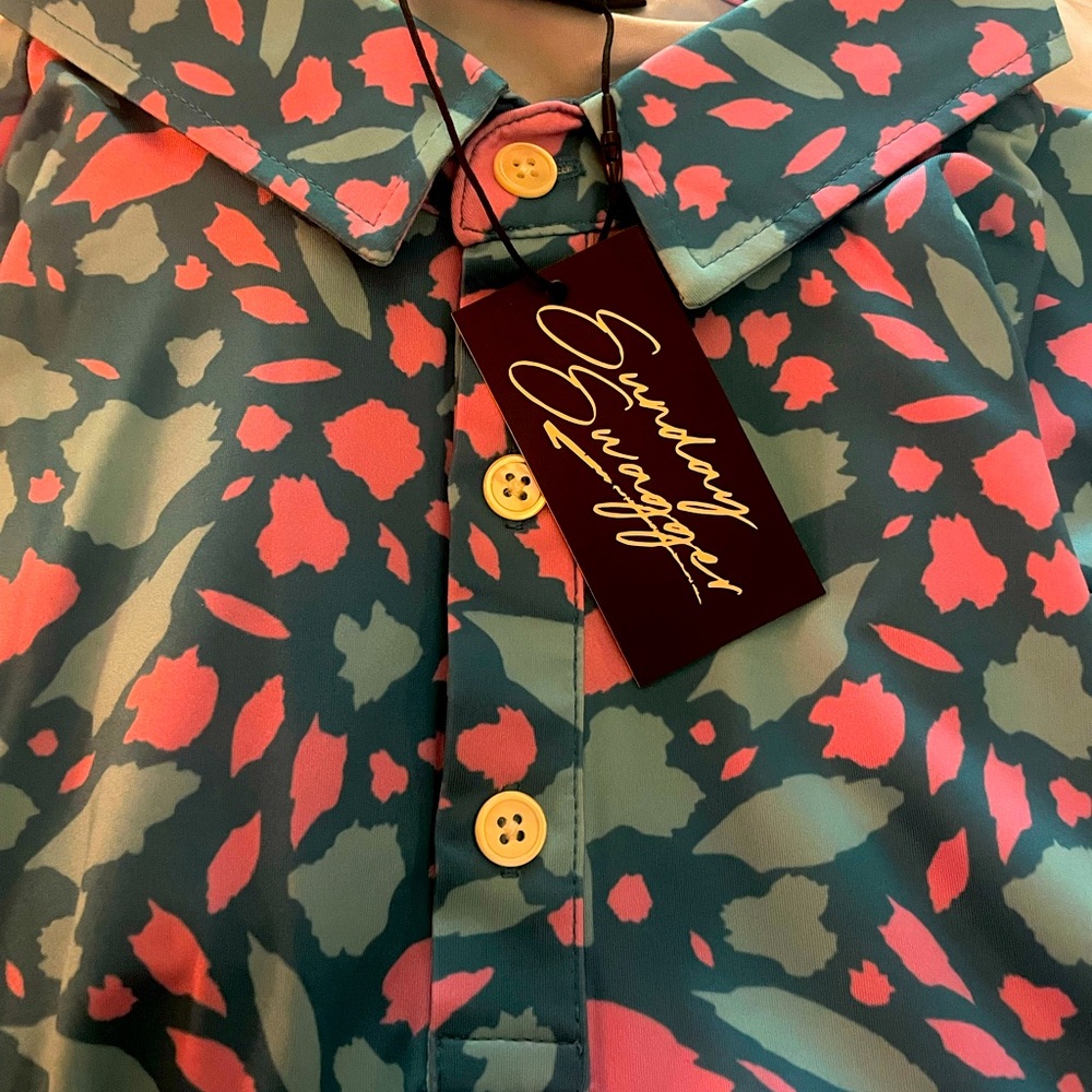 Look sharp at work, on a date or on the course with this NWT shirt